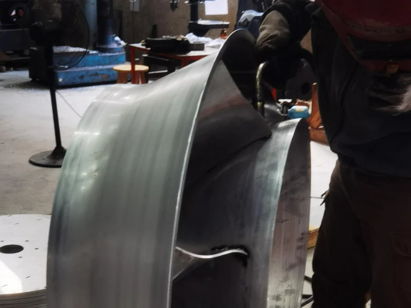 Manual welding of mixed flow fan impeller